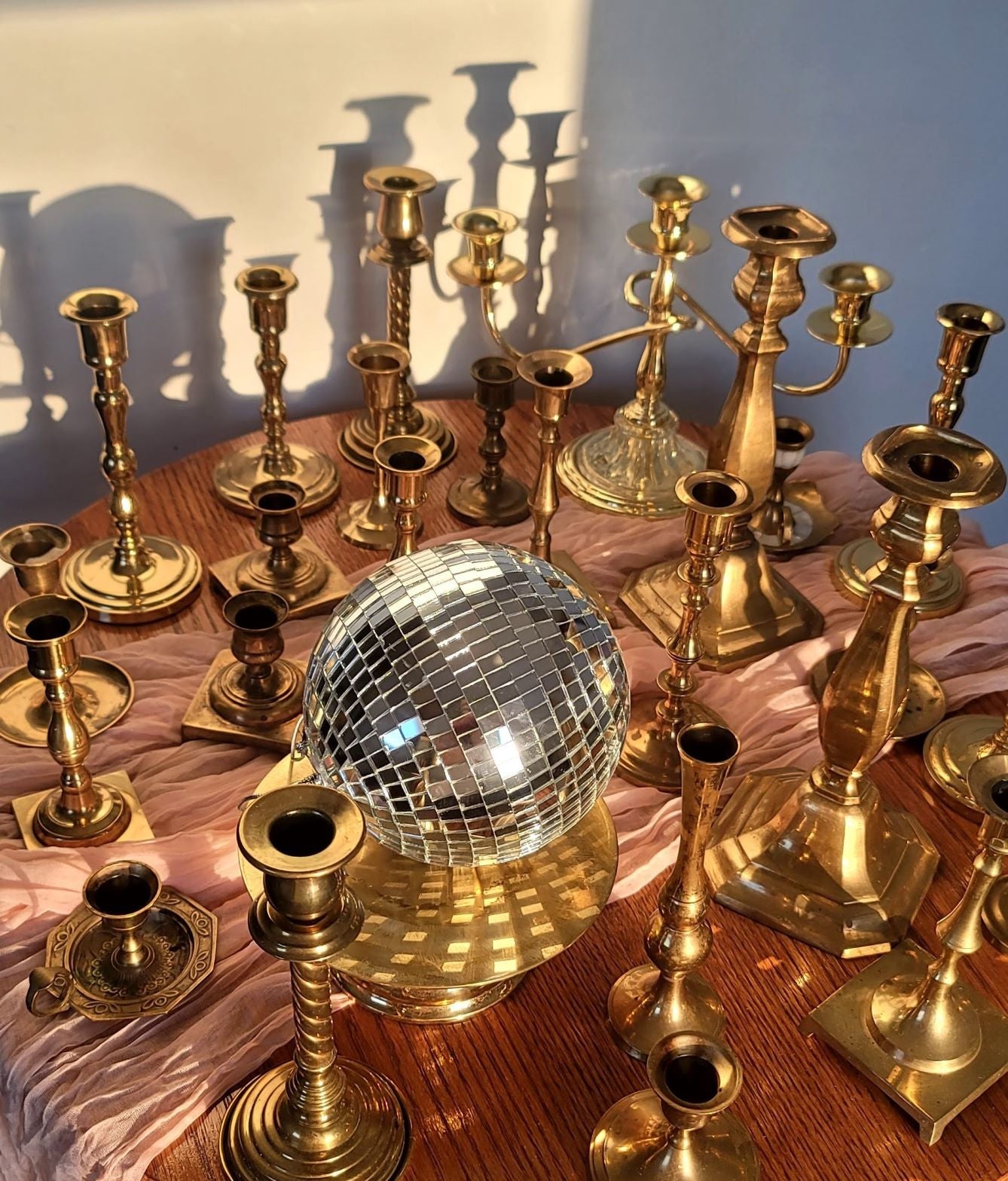 A collection of vintage brass candlesticks and candleabras for taper candles. Beautiful gold canlde holders, brass candle holders, candle sticks for rent in Winnipeg and surrounding areas.